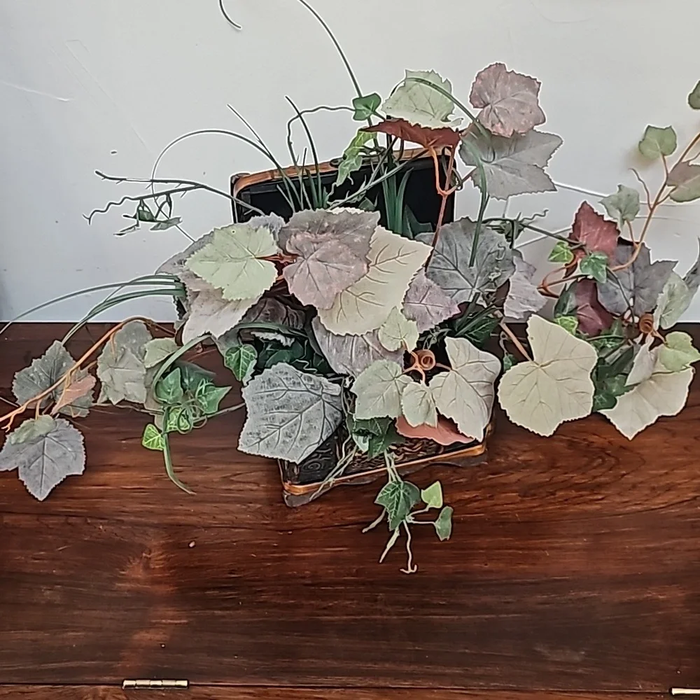 Vintage faux plant in wooden chest box decoration